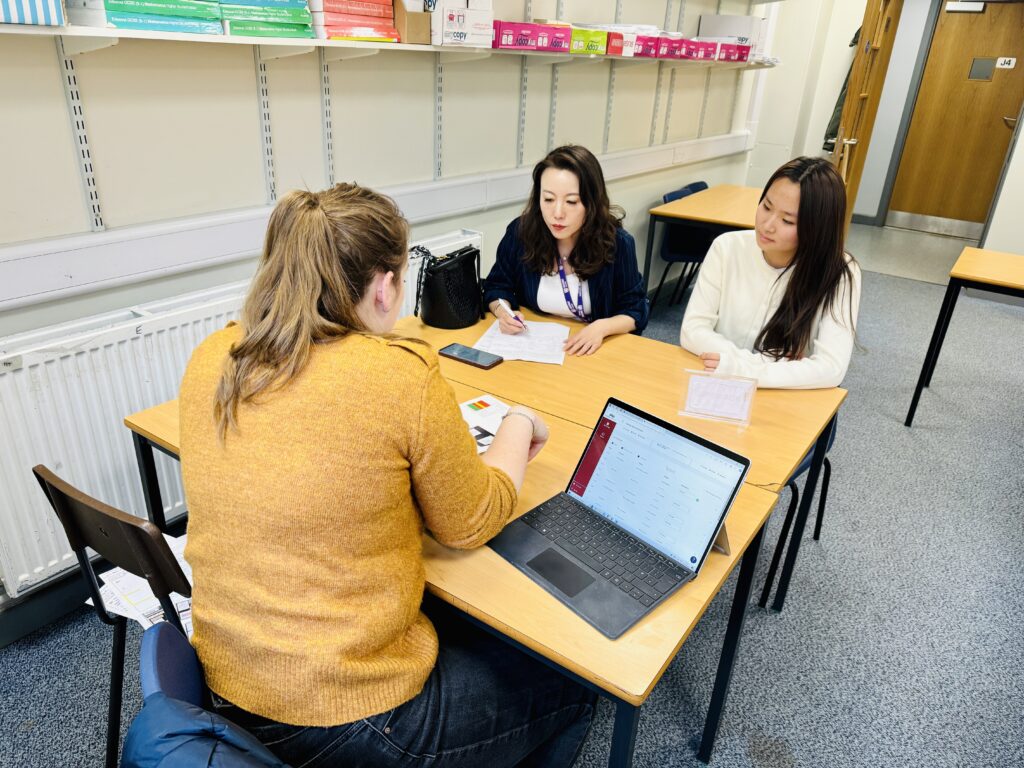 Our guardian Yuki attending a parents’ evening at Akeley Wood School with student Ms. Miao