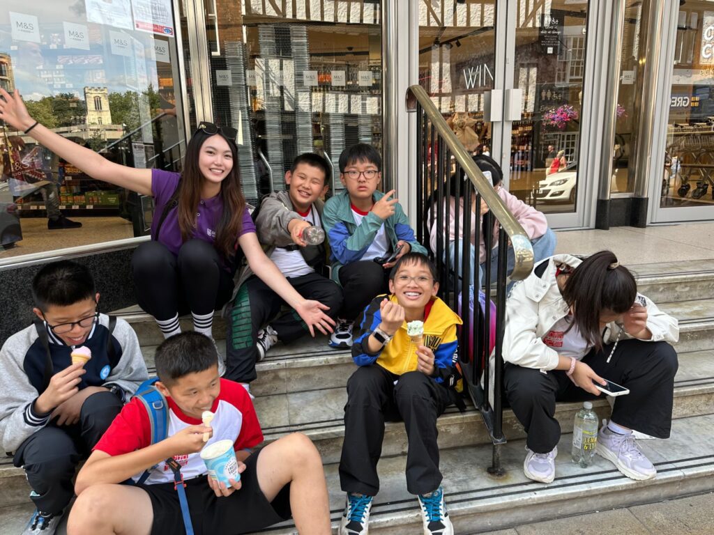 Group of students enjoying outdoor activities with their camp leader during a summer camp at Gateway Education.